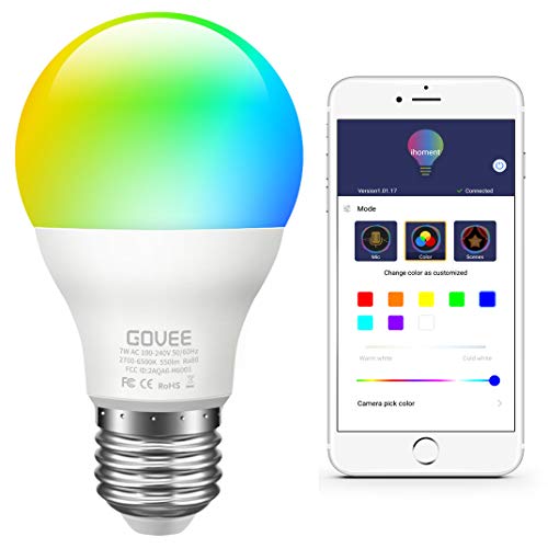 Light bulb that changes color next to an iphone that controls it.