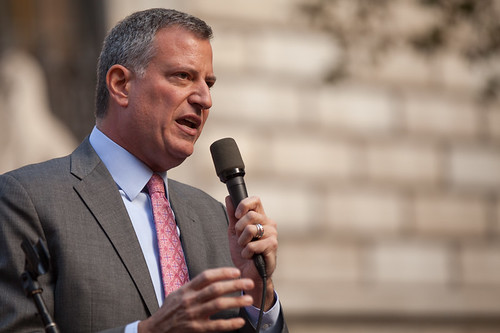 Mayor de Blasio speaks into a microphone.