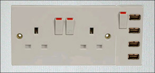 White switchplate, roughly 3x6 inches, with 4 USB ports and several switches.