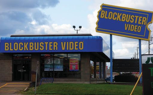 Outside view of a blue Blockbuster Video store.