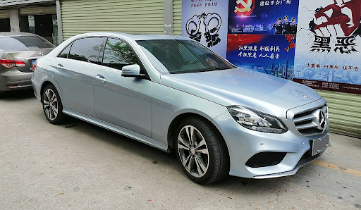 Silver Mercedes-Benz E-Class V212 parked outside of a building in China.