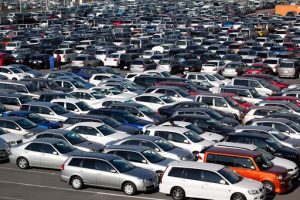 Hundreds of cars parked in a HAA Kobe parking lot in Japan.