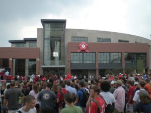 Outside view of the David Letterman Building with dozens of people outside. 