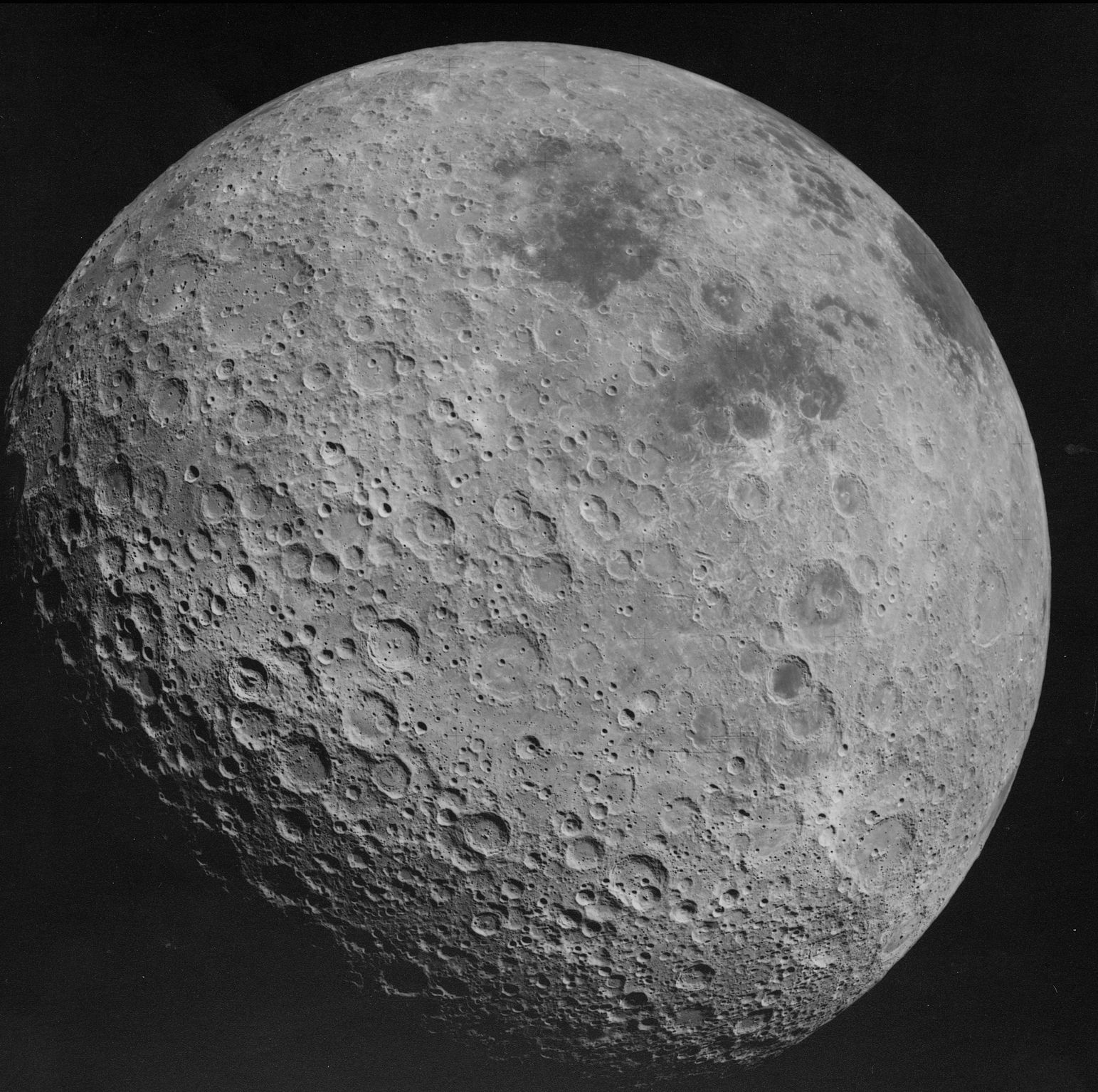 The far side of the Moon, gray in color and covered in numerous craters.