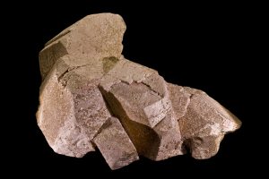 A group of crystals of pink potassium feldspar growing together.