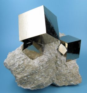 Metallic gold-colored cubic crystals of pyrite.