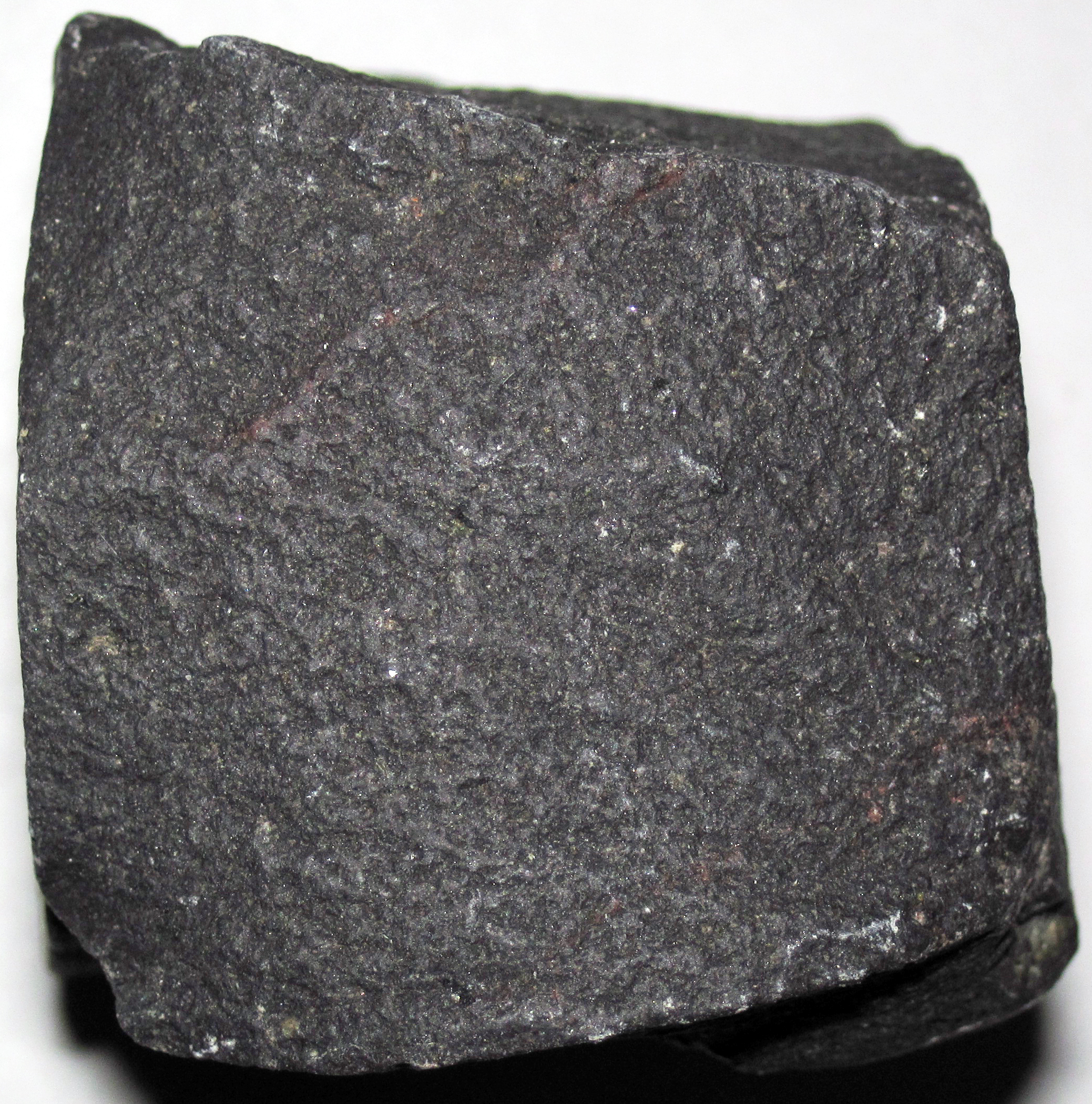 Sample of basalt that is dull black without any clearly visible grains.