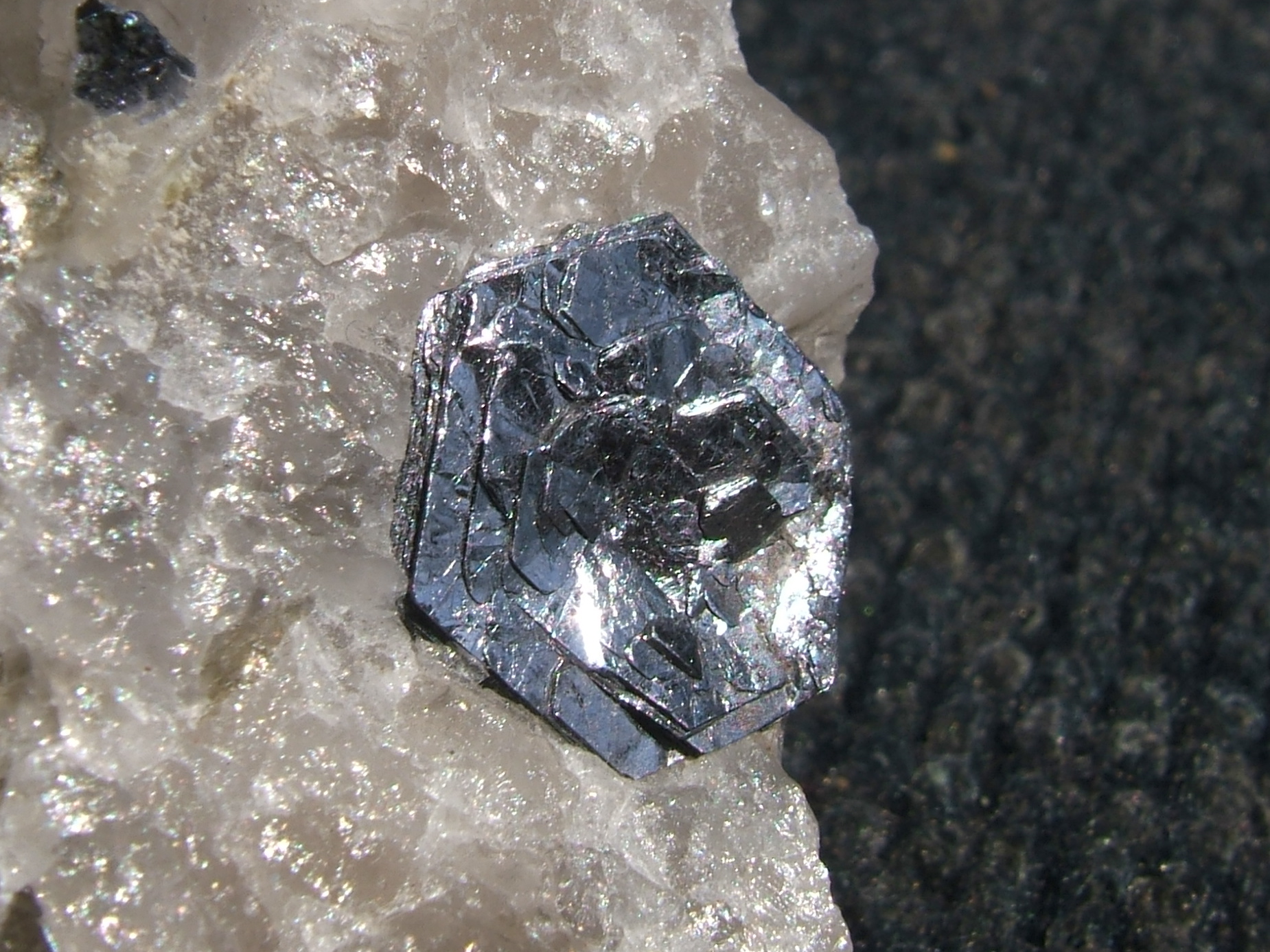 A gray metallic crystal.