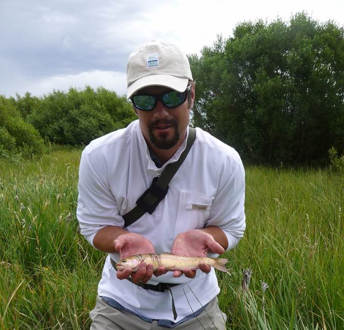 Daniel Dauwalter holding a trout