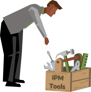 A cartoon drawing of a man wearing a gray long sleeve shirt, black pants and black shoes reaching for a wooden toolbox containing a screwdriver, hammer, wrench, ruler, and pliers labeled "IPM Tools."