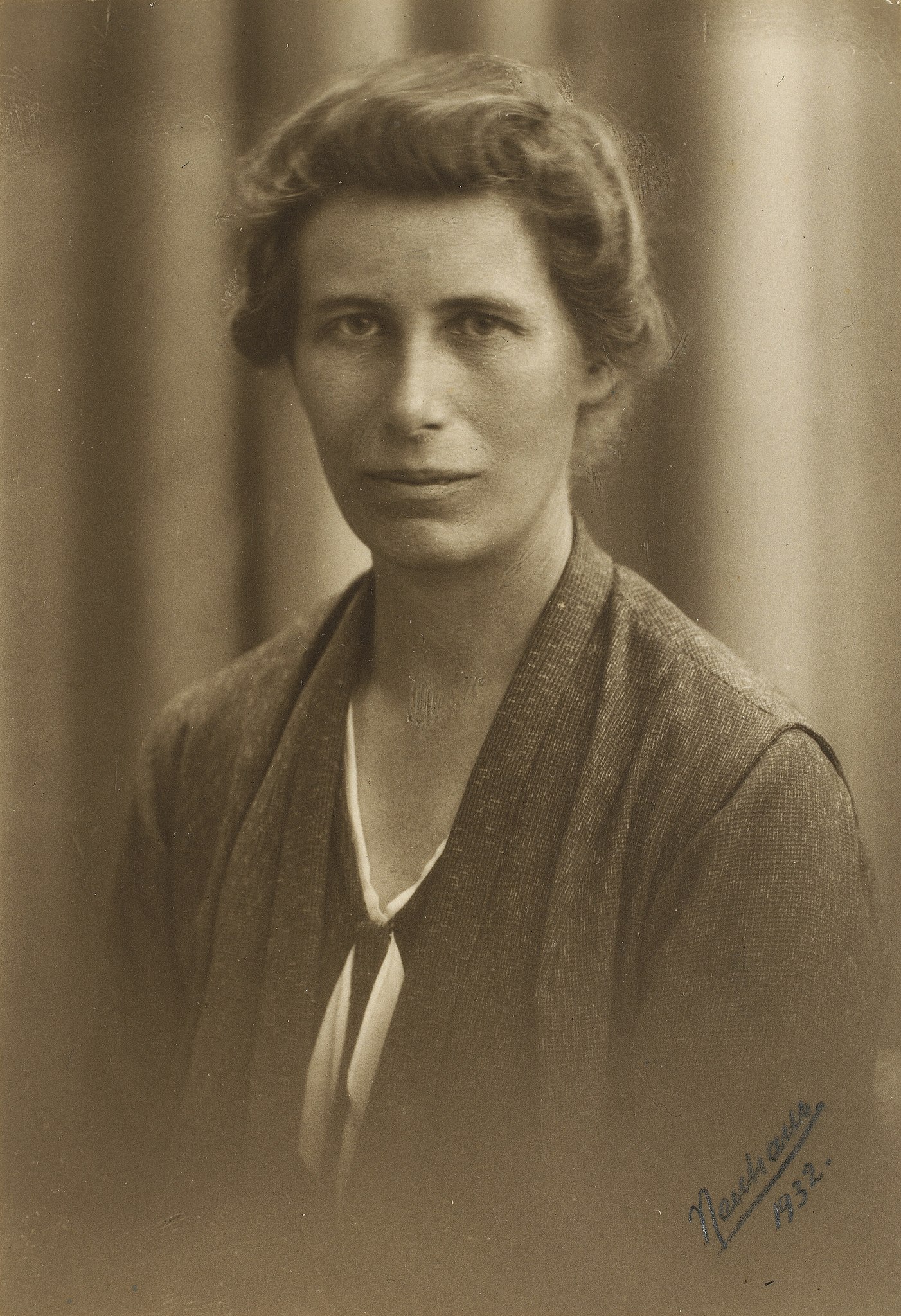 Antique photo of young woman wearing a sweater.