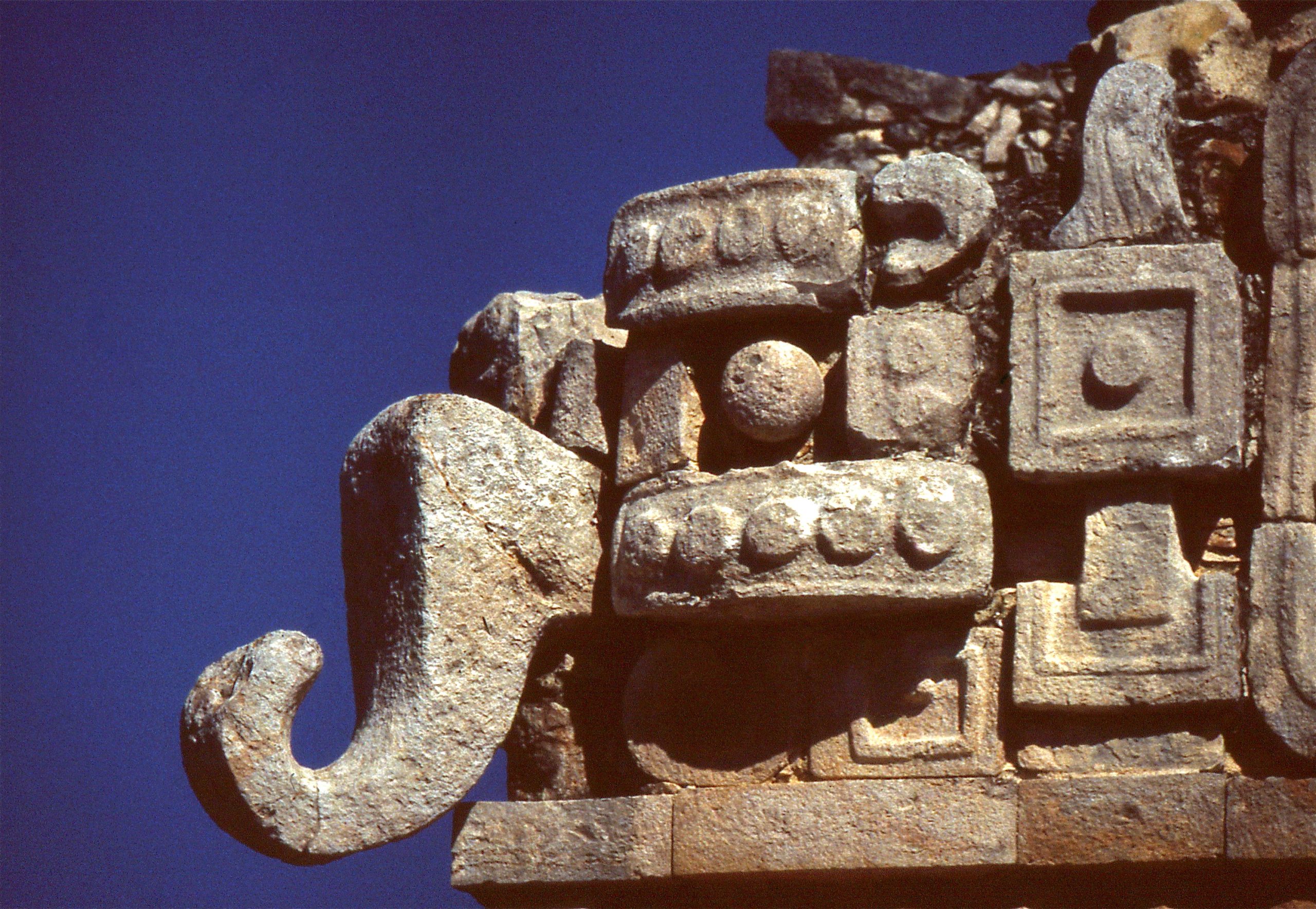 Mayan stone figure with a long elephant-like nose representing a water deity.