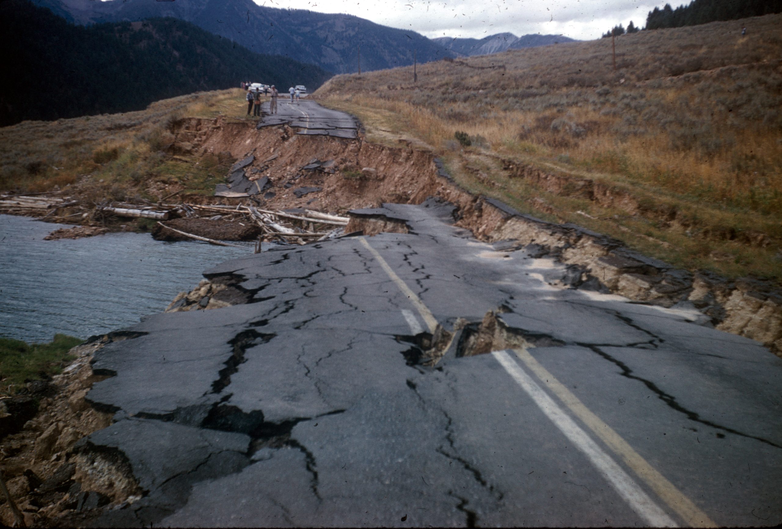 Road that is cracked and fully split apart.