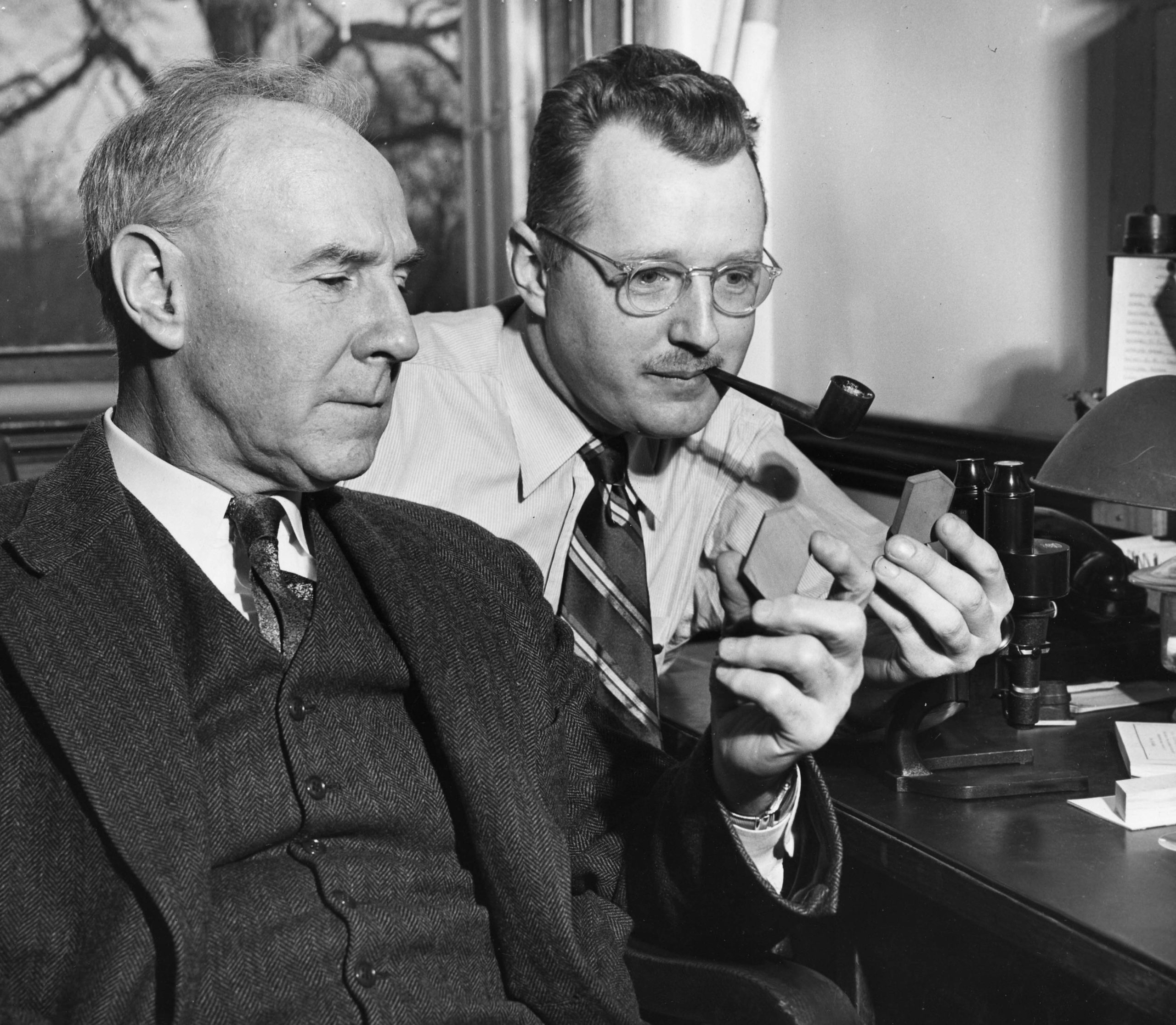 Photo of Bowen and Tuttle sitting down looking at samples