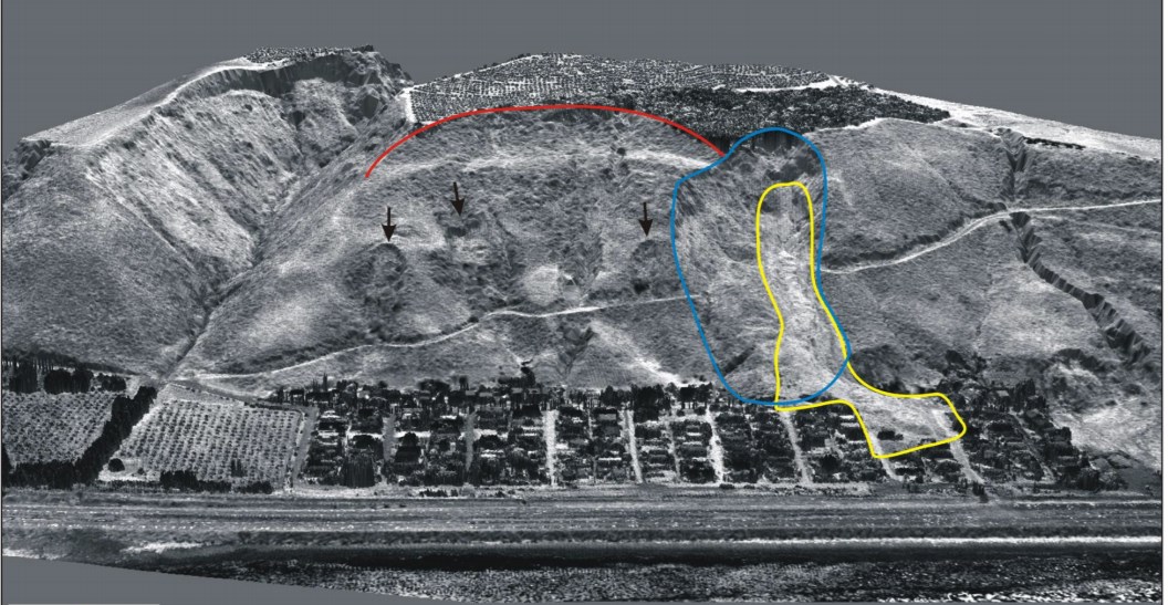 Black and white LIDAR image of a hillside with landslides outlined: a blue oval outlines a vertical landslide scarp; it overlaps a yellow elongate outline of another vertical landslide; a red arc near the top of the slope with black arrows pointing downward denotes another landslide; neighborhood buildings are visible at the base of the slope.