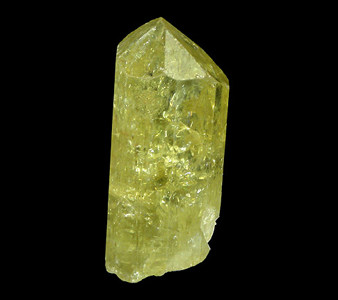 The crystal is hexagonal and light green.