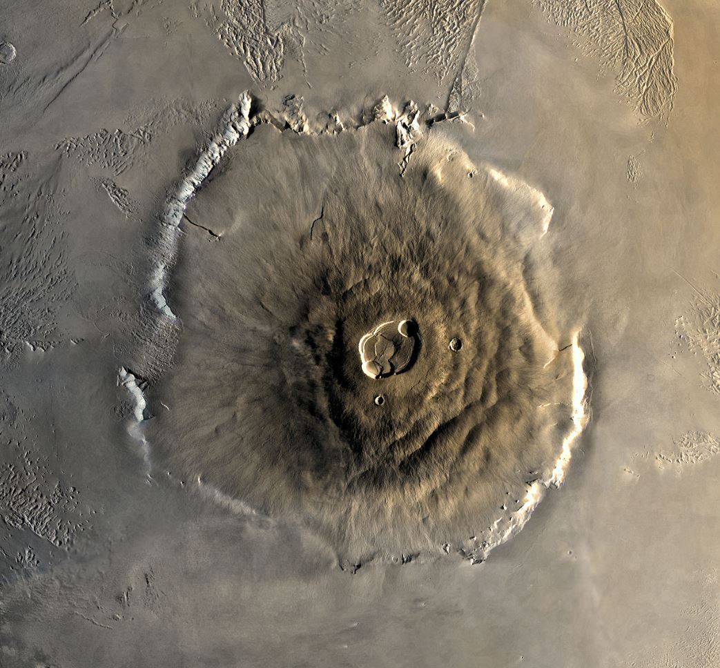Ariel view of volcano. Symmetrical and round with the dark part focused in the center