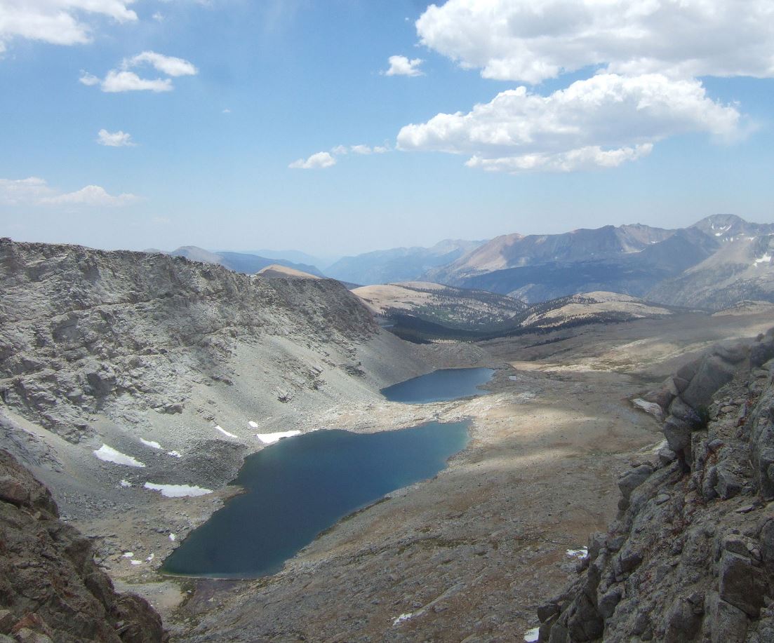 Series of elongate lakes between moraines within an alpine glacial valley.