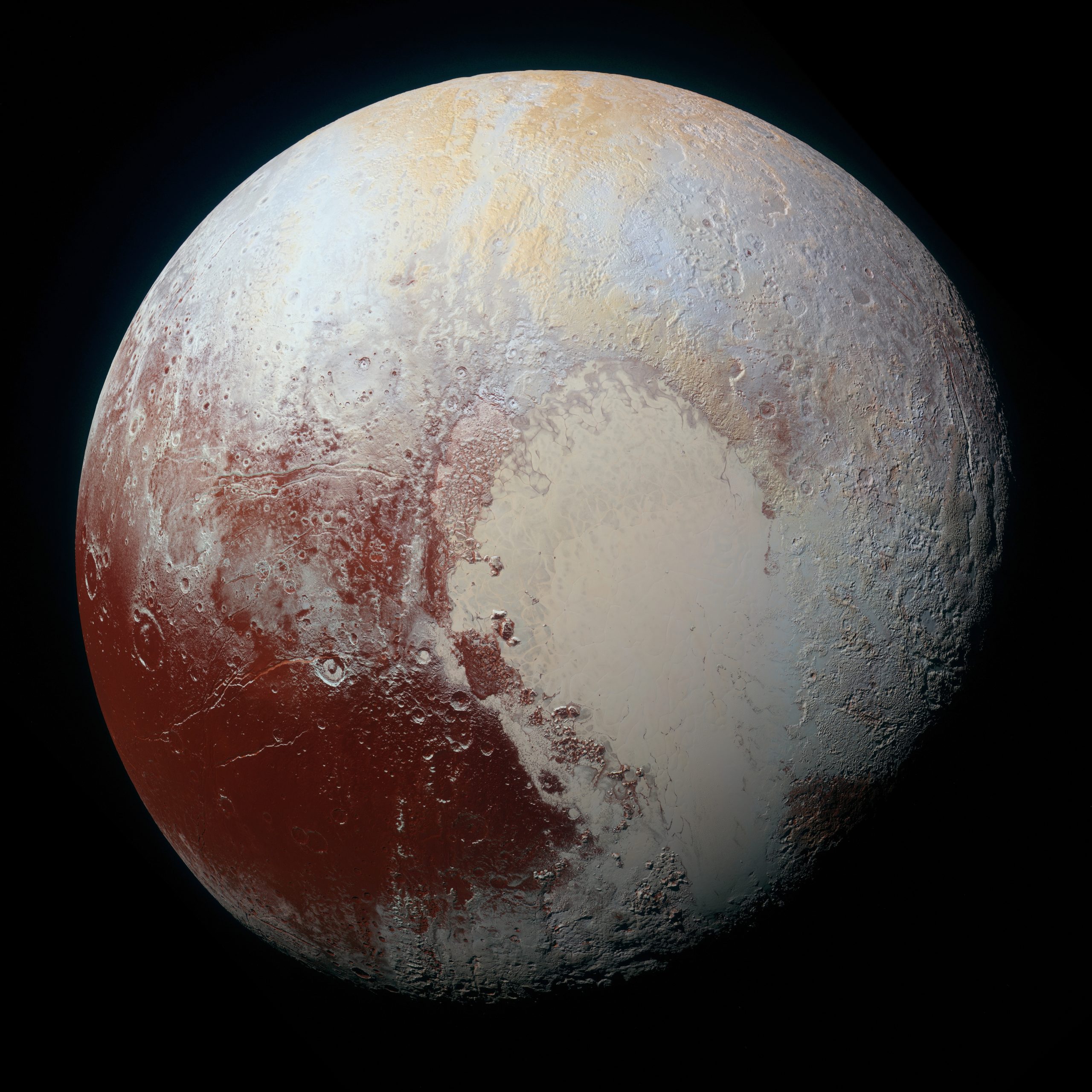 Image of the surface of Pluto. In this photograph, the smooth, white Sputnik plains are seen covering most of the upper right of the image. Rugged, heavily cratered terrain covers the lower center and upper left.