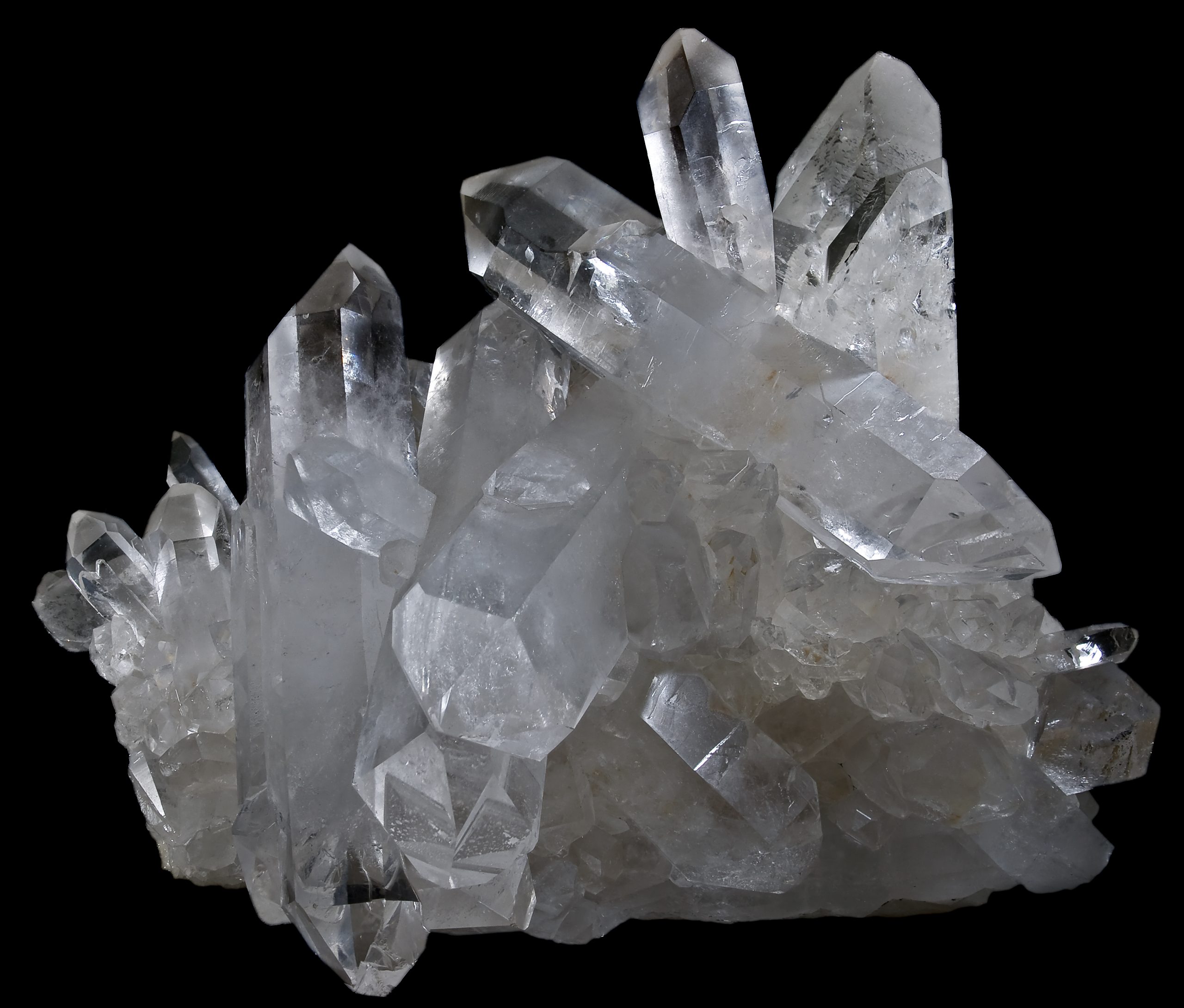 White, transluscent, long, then, glassy crystals poking in many directions